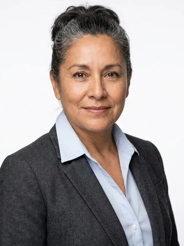 Example attorney headshot: Studio White · Charcoal Blazer