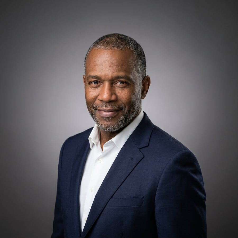 Example LinkedIn headshot: Studio Gray · Navy Suit